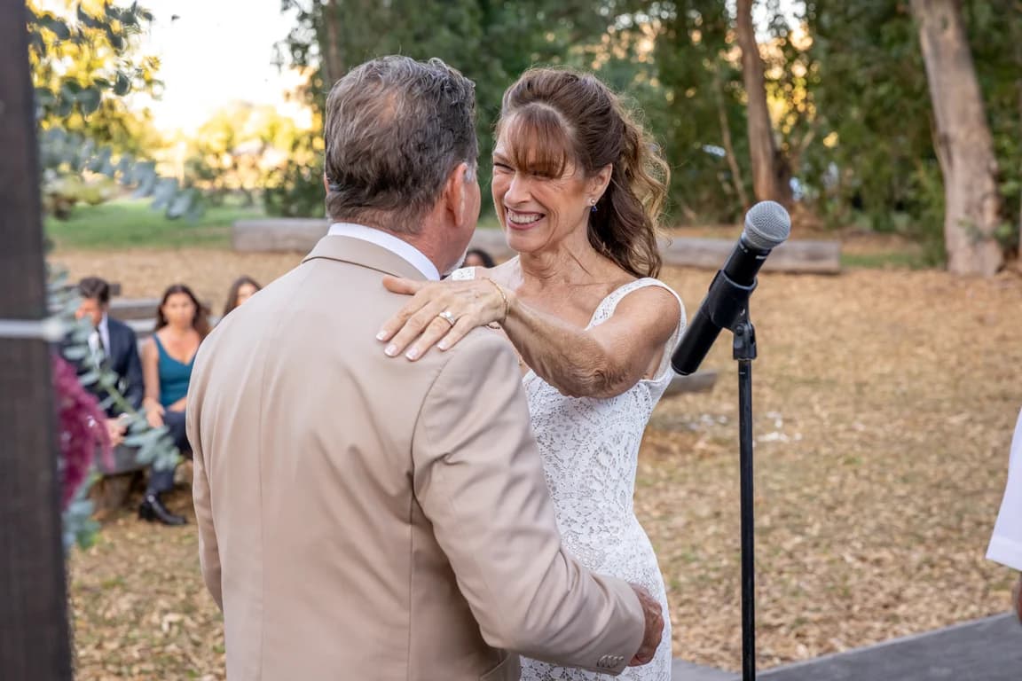 Joy laughing with Randy during the ceremony