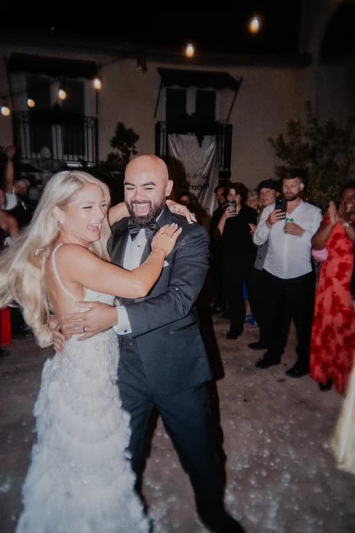 Jovin + Jordyn laughing with guests on the dance floor