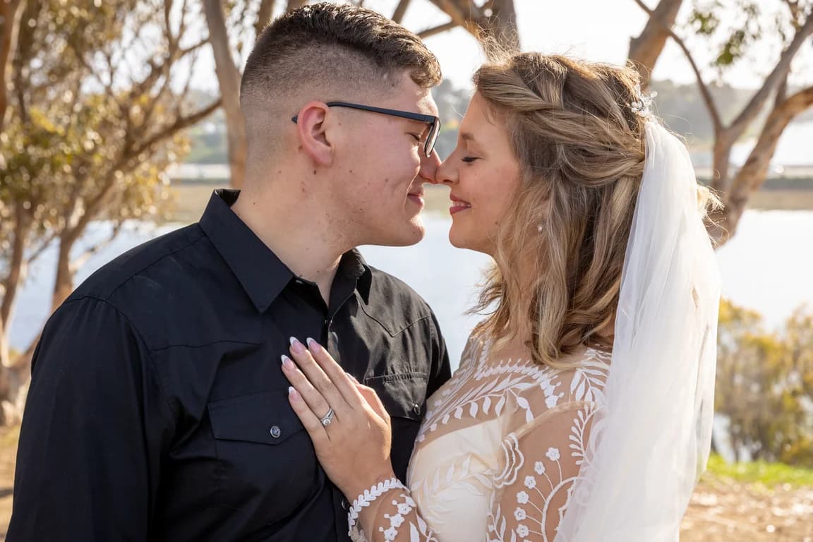 Corbin + Michaela nose to nose, her ring in view