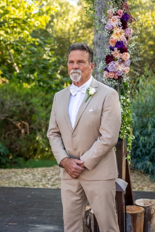 Randy waiting at the floral arch