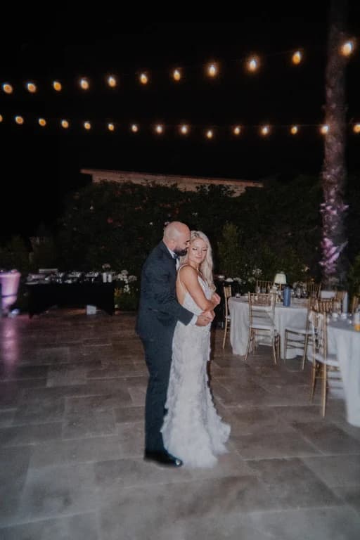 Jovin + Jordyn's first dance on the patio under string lights