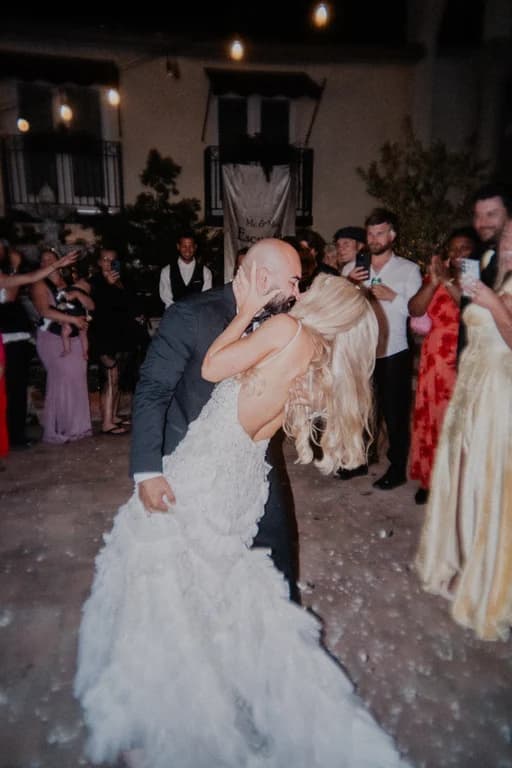 Jovin + Jordyn kissing among their guests