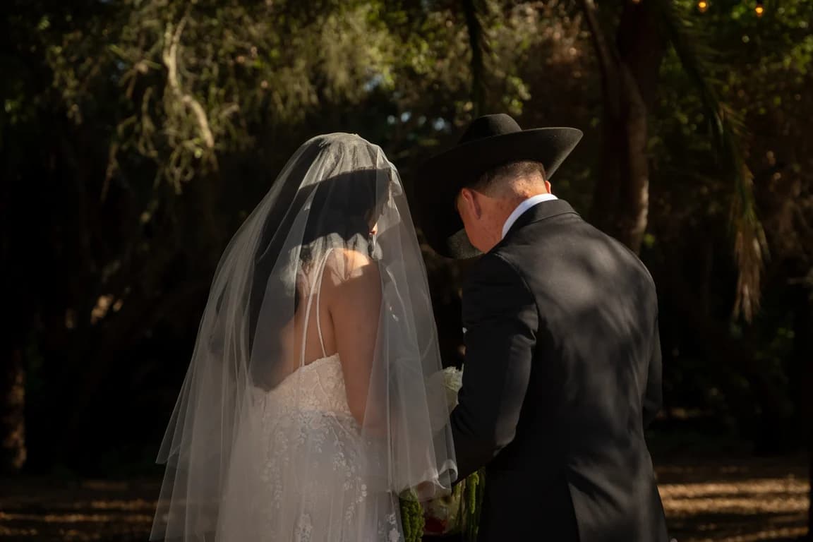Julissa under her veil facing Josh