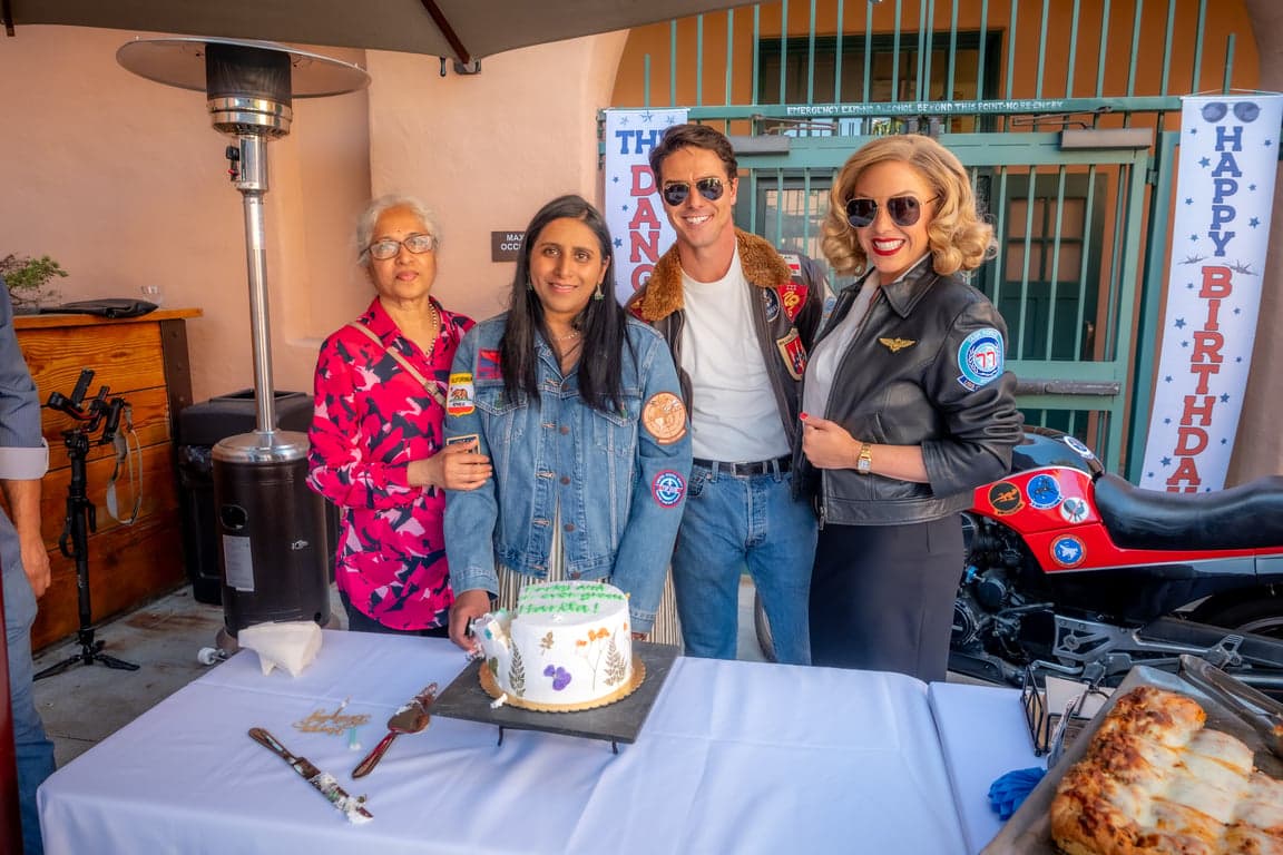 Haritha's celebration — cake cutting captured in golden light