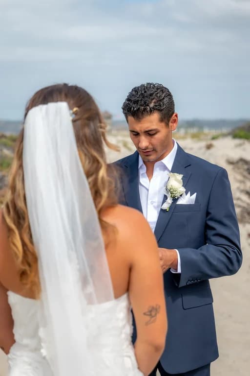 Kiara and Niko during the vows, her veil in the wind