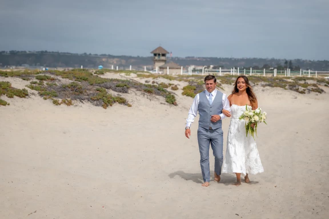 Kiara walking down the beach aisle