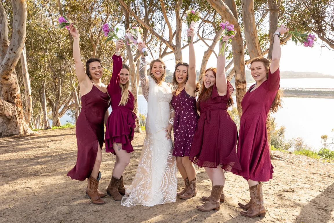 Groomsmen holding Corbin sideways for a photo