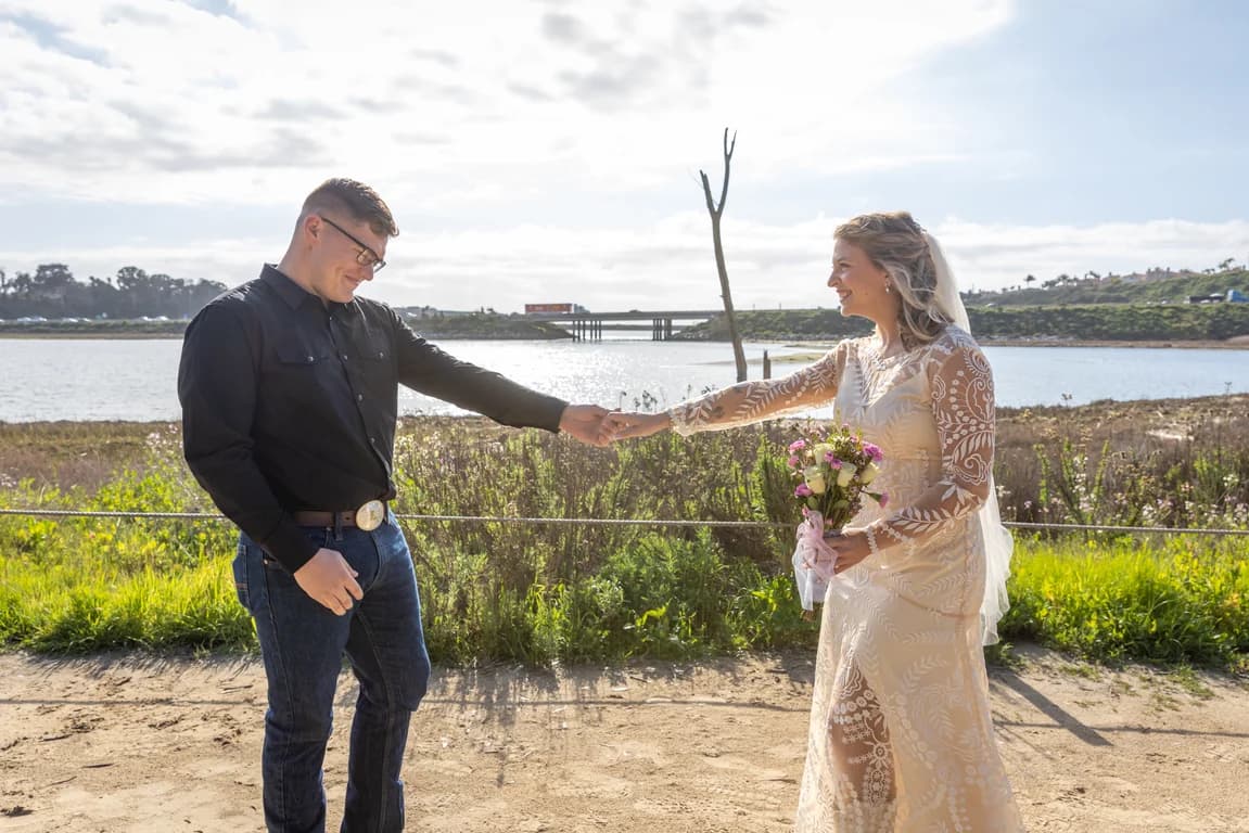 Corbin turning to see Michaela, the lagoon behind them