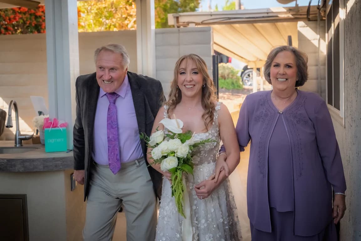 Katy walking down the aisle with family