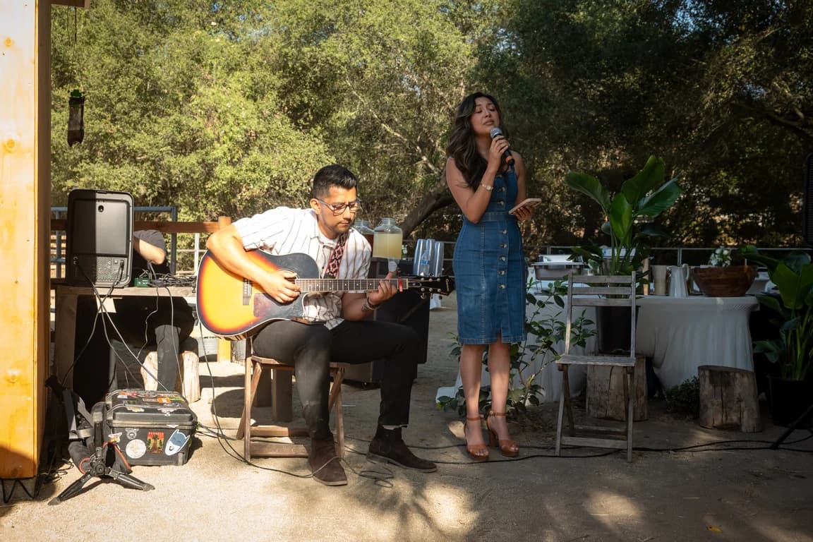 A singer and a guitarist playing at the ceremony