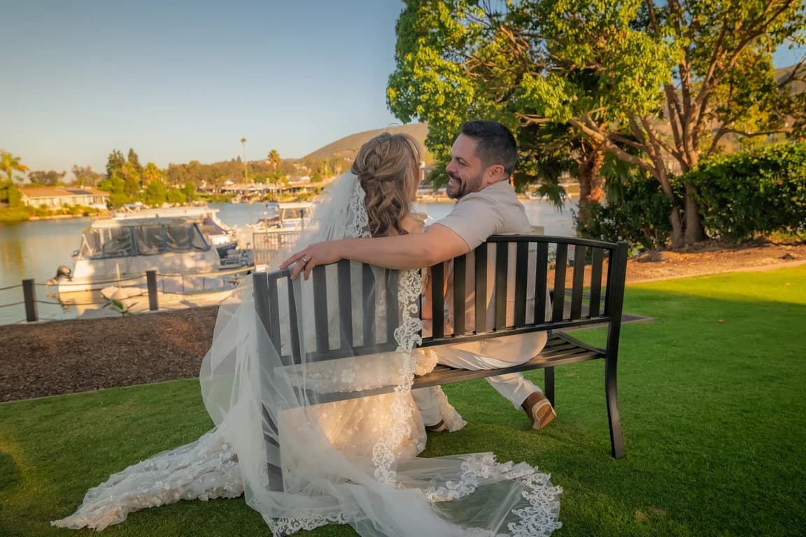 Katy + Ryan on a bench overlooking the lake