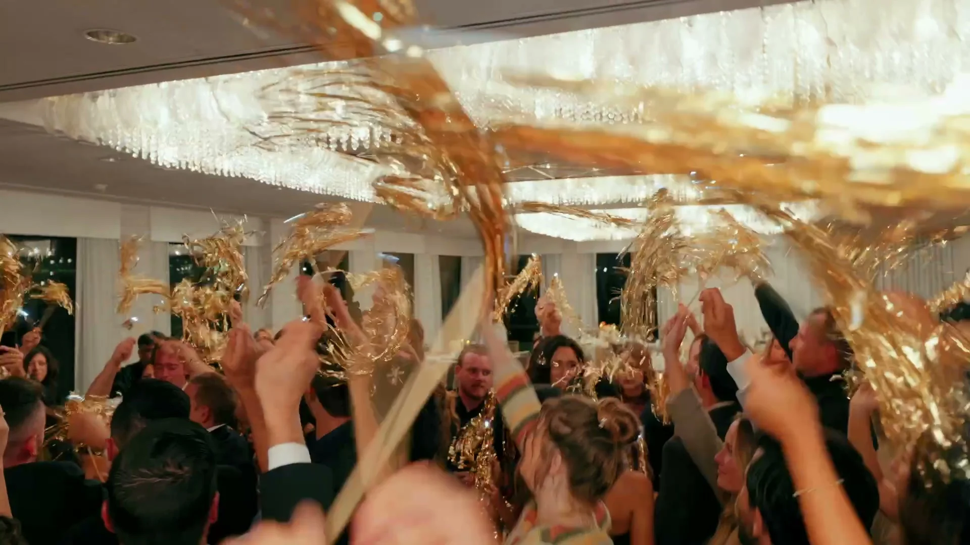 Gold tinsel in the air over the dance floor