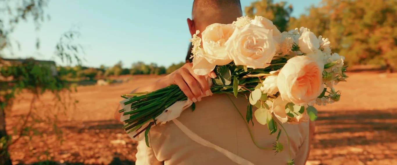 Yesenia's bouquet of white roses in golden light