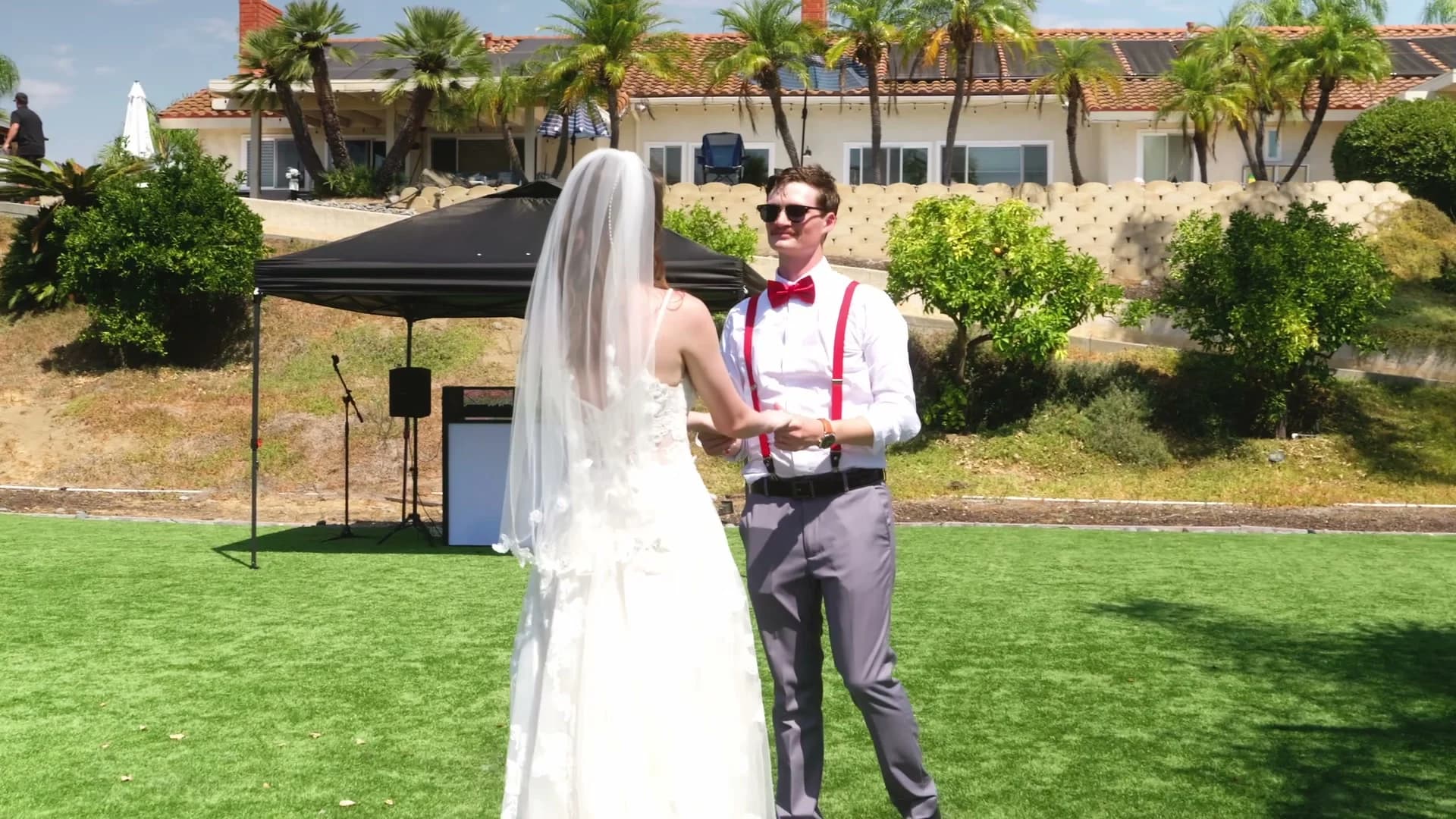 Lizzy walking up to Jonathan in the backyard