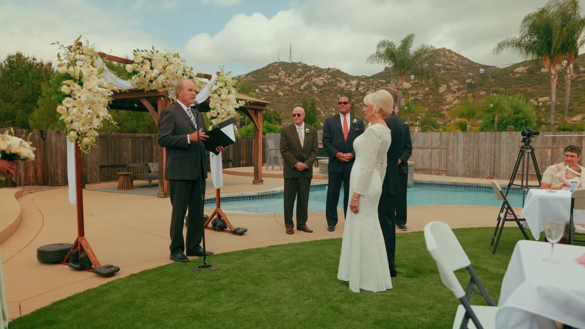 The ceremony by the pool, the hills of El Cajon behind it