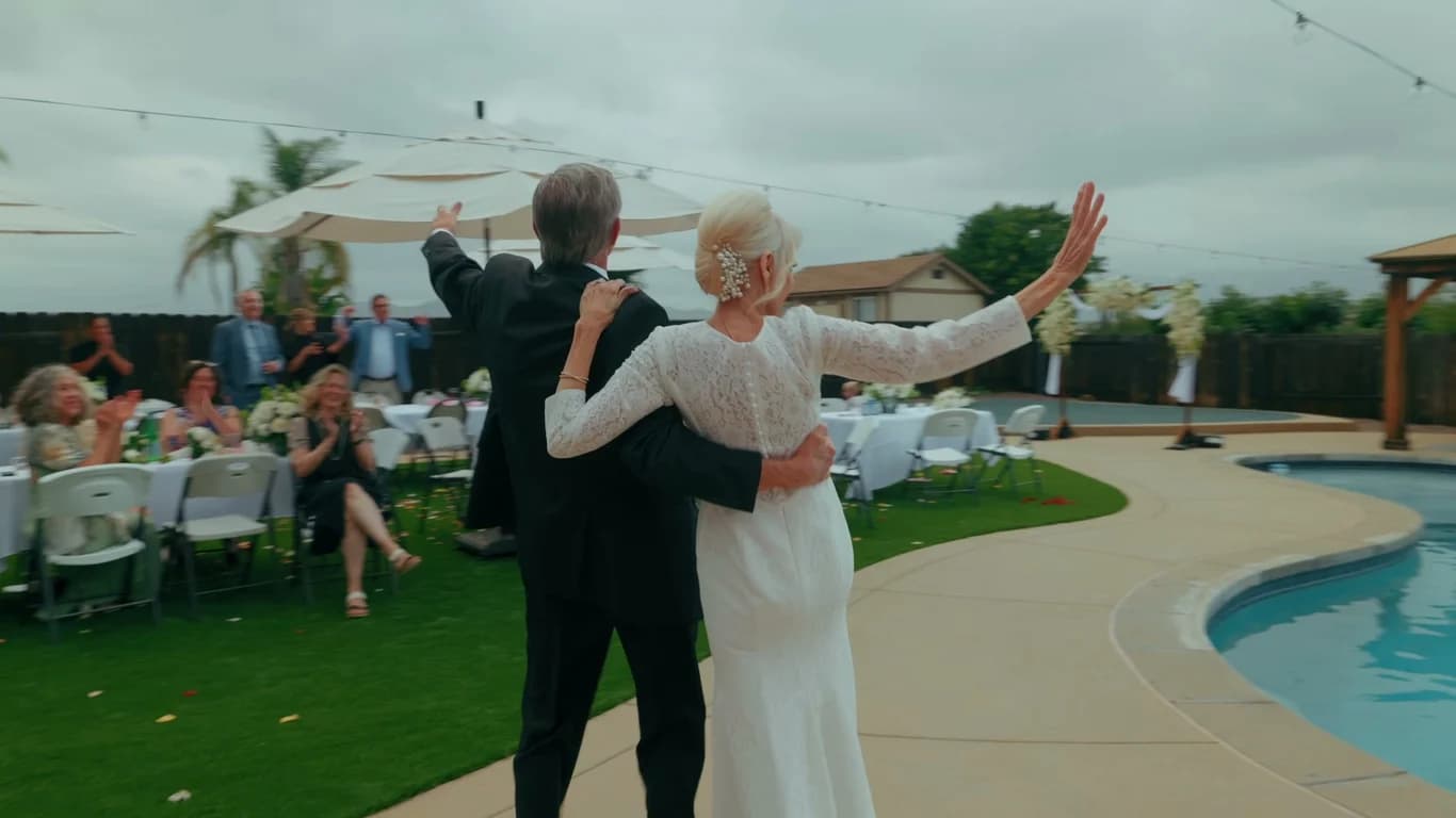 Luana waving to guests during the first dance