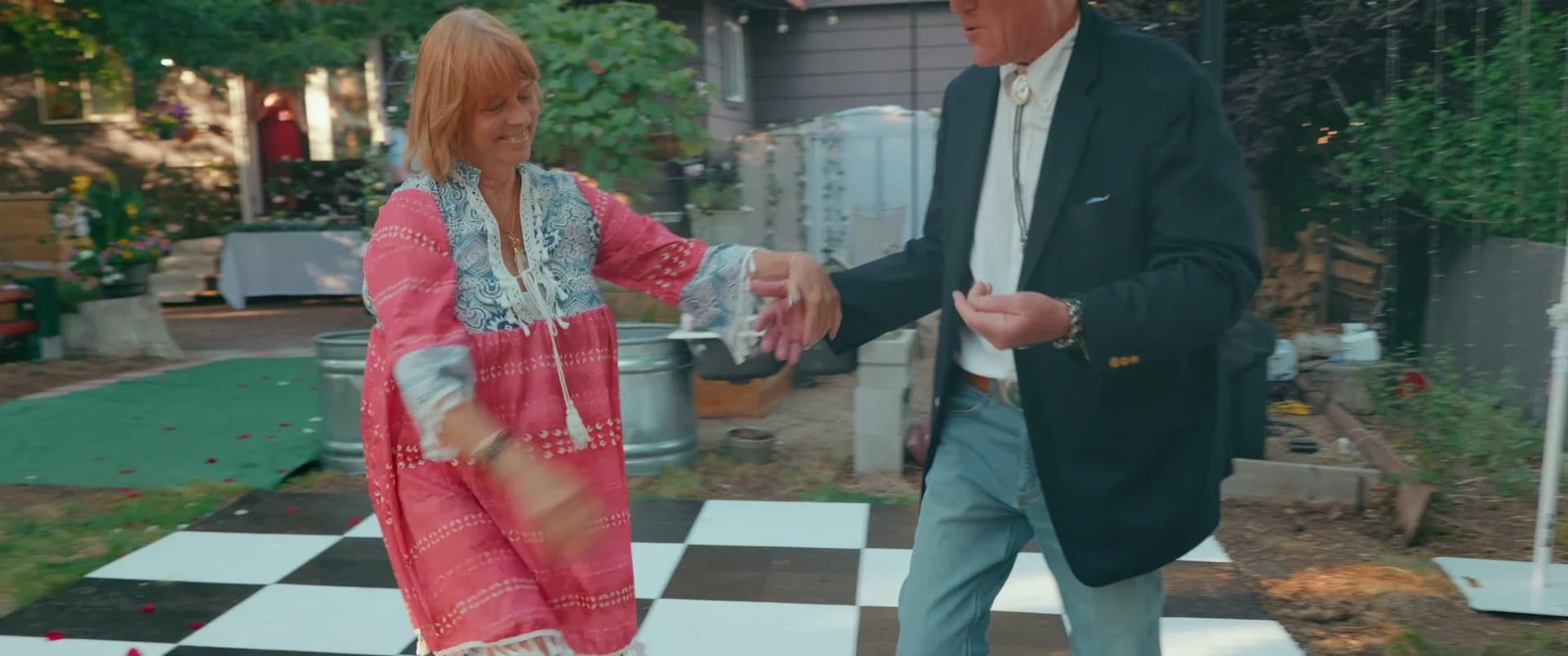 Guests dancing on the checkered dance floor