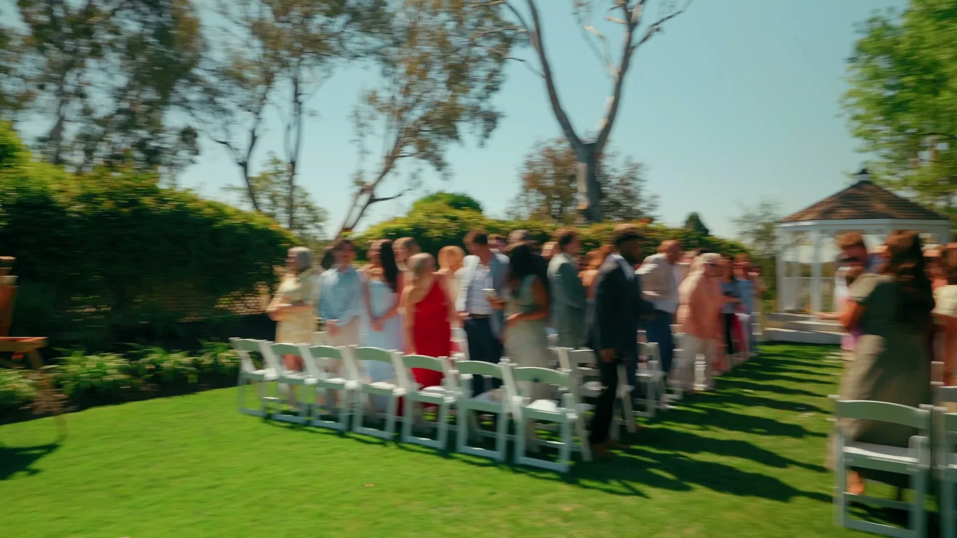 The aisle across the lawn to the white gazebo