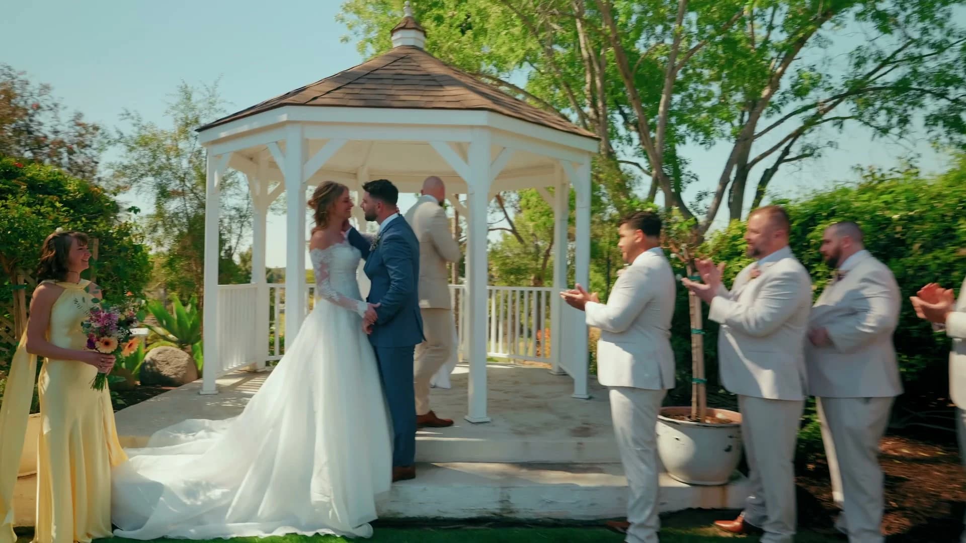 Brett + Kat holding hands at the gazebo steps