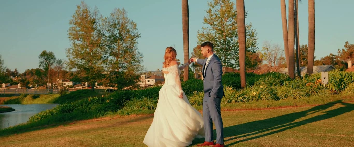 Kat turning toward Brett on the lawn