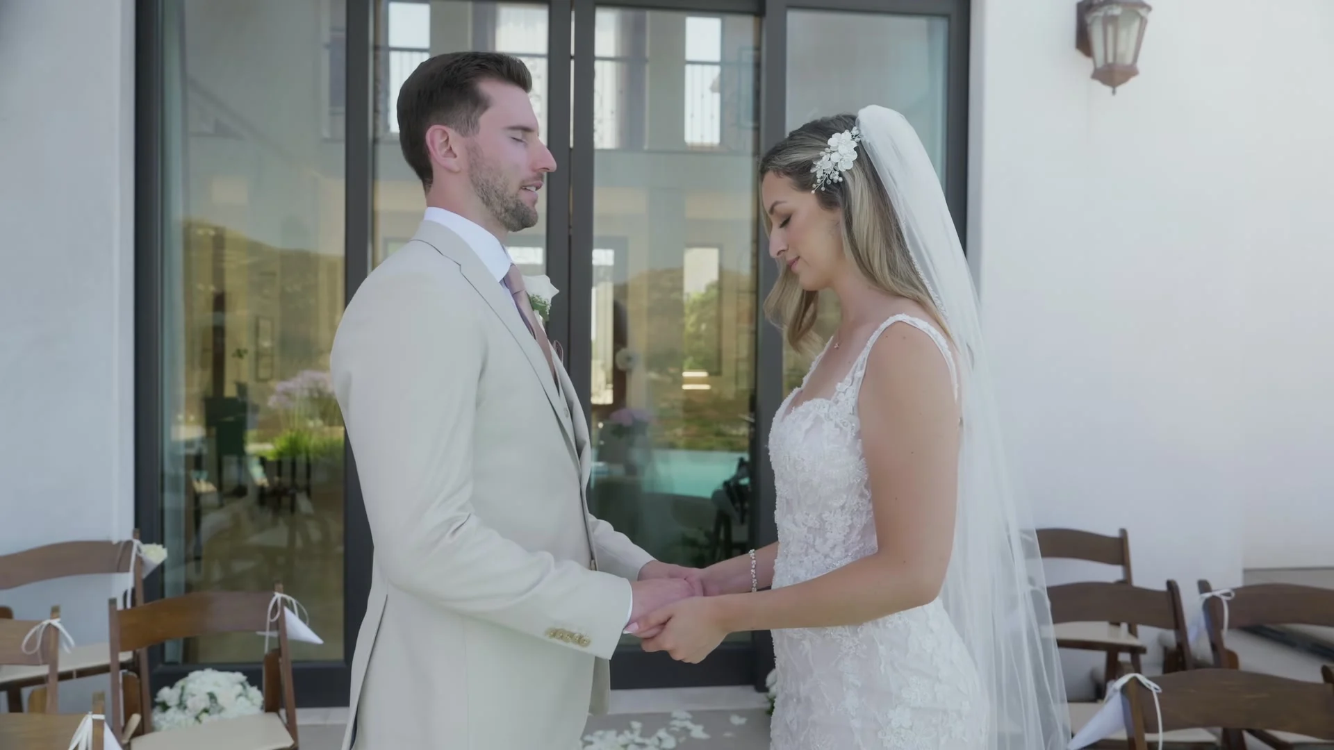 Patrick + Megan holding hands indoors