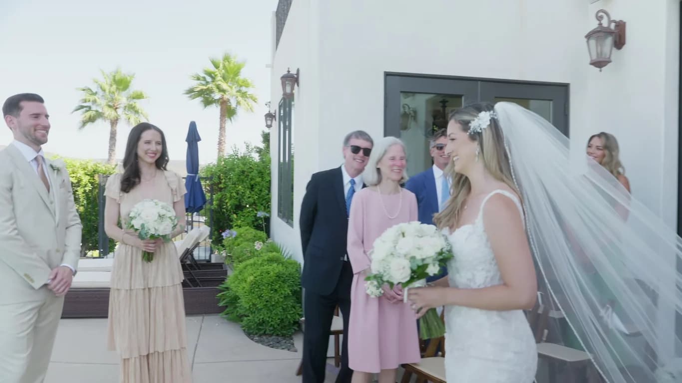 Megan greeting family on the terrace before the ceremony