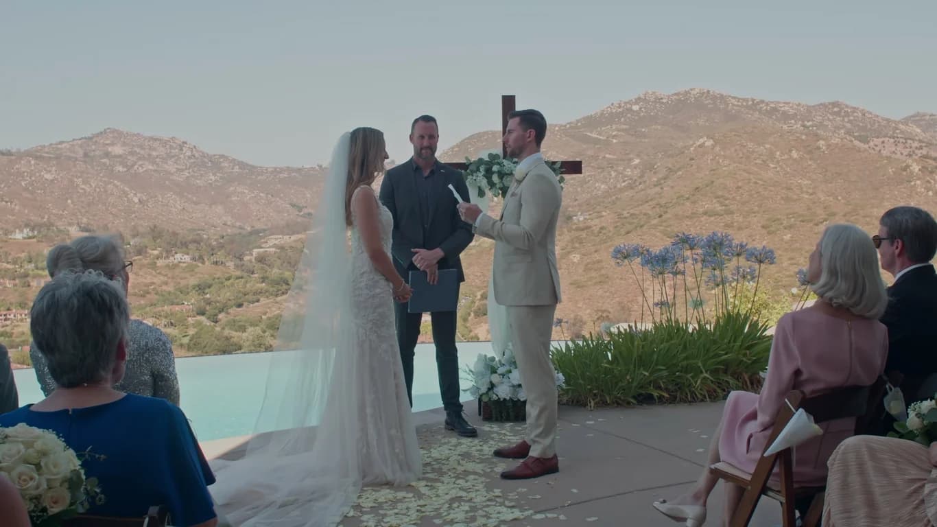 Patrick reading his vows in front of the wooden cross