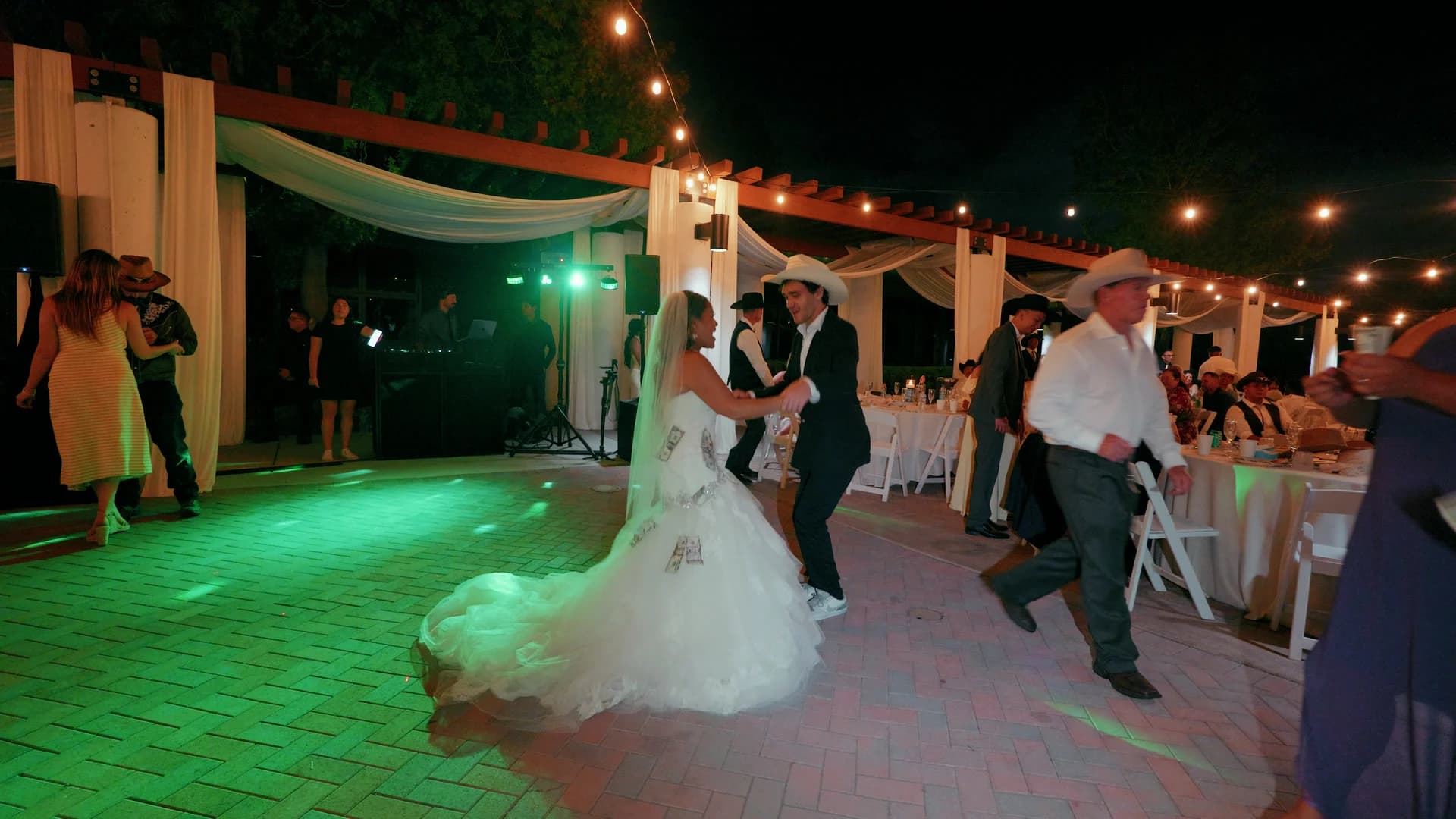 Pearl on the dance floor under string lights