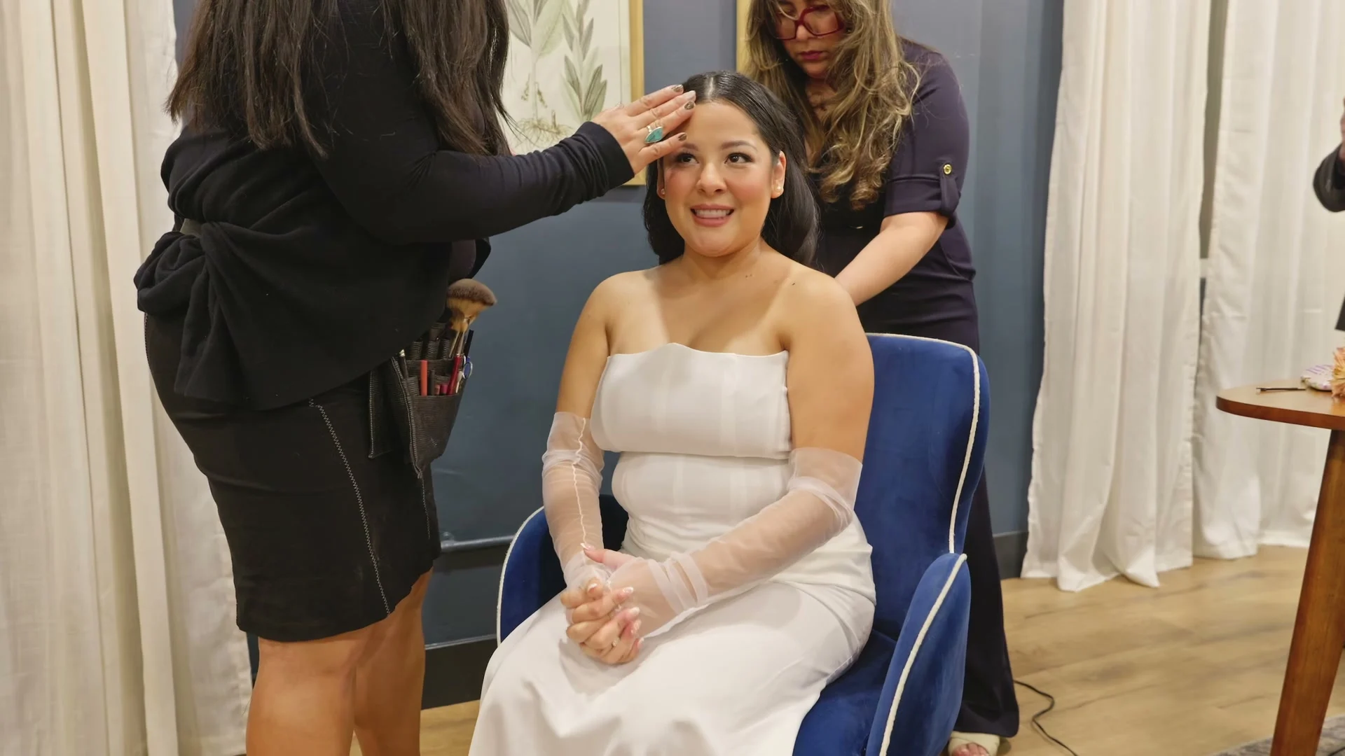 Sabrina's hair being finished in the bridal suite