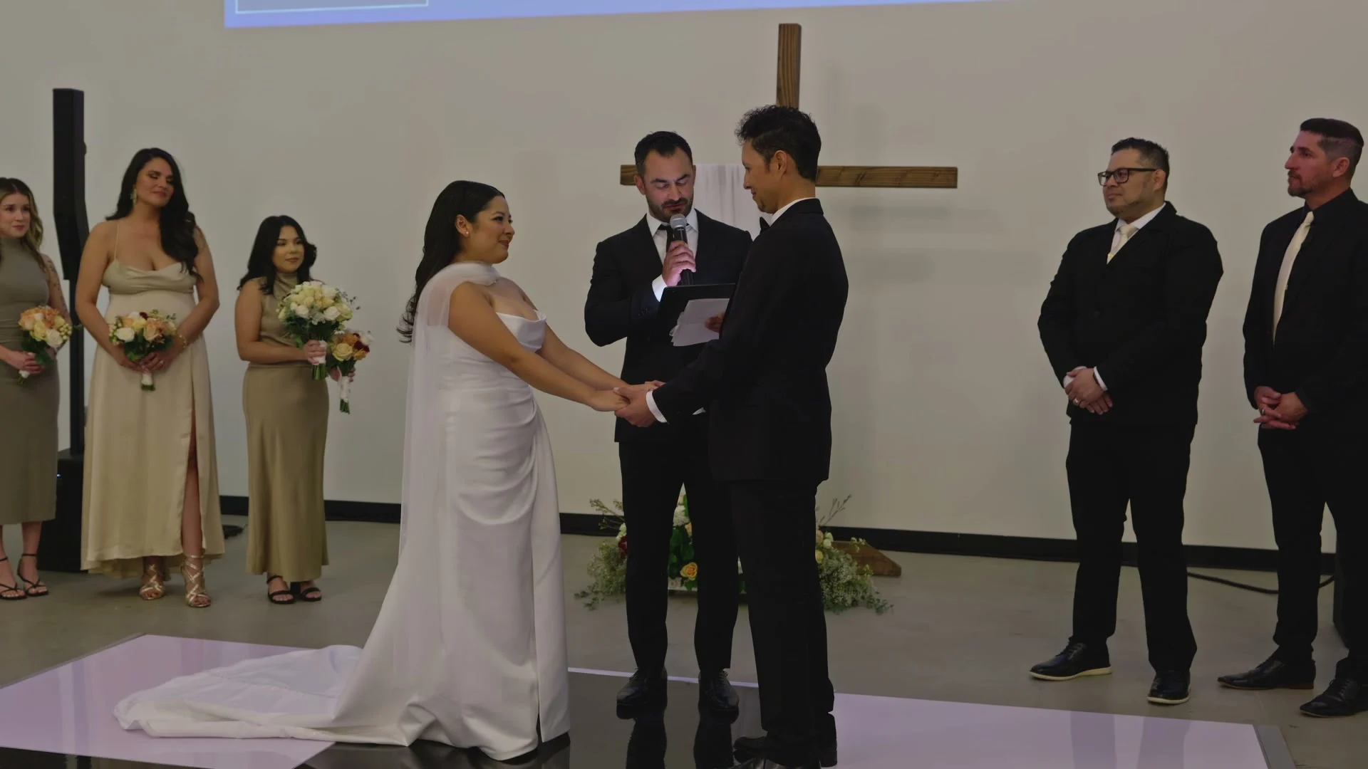 Sabrina + Caleb holding hands for the vows