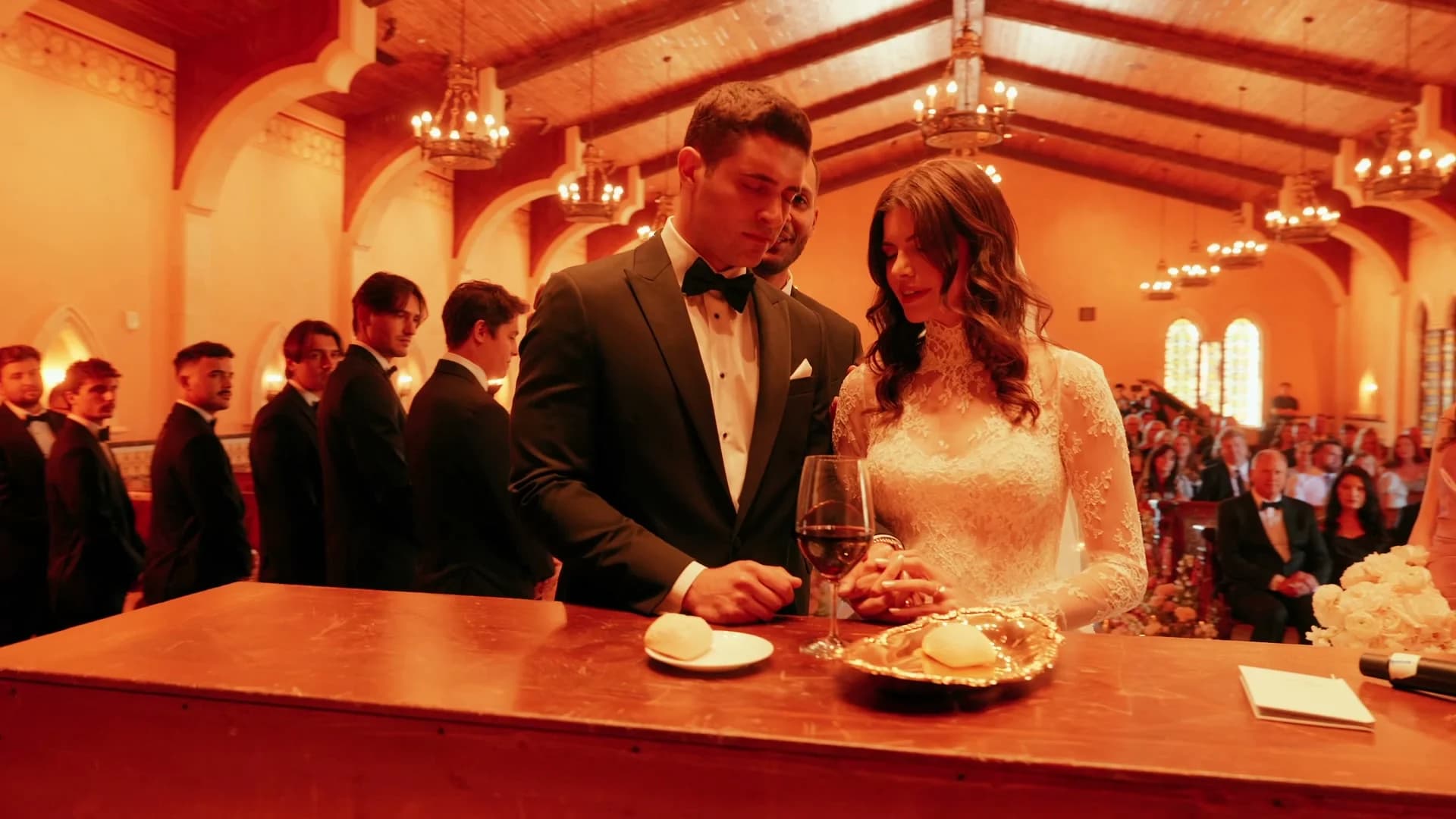 Theo + Kristen at the communion table during the ceremony
