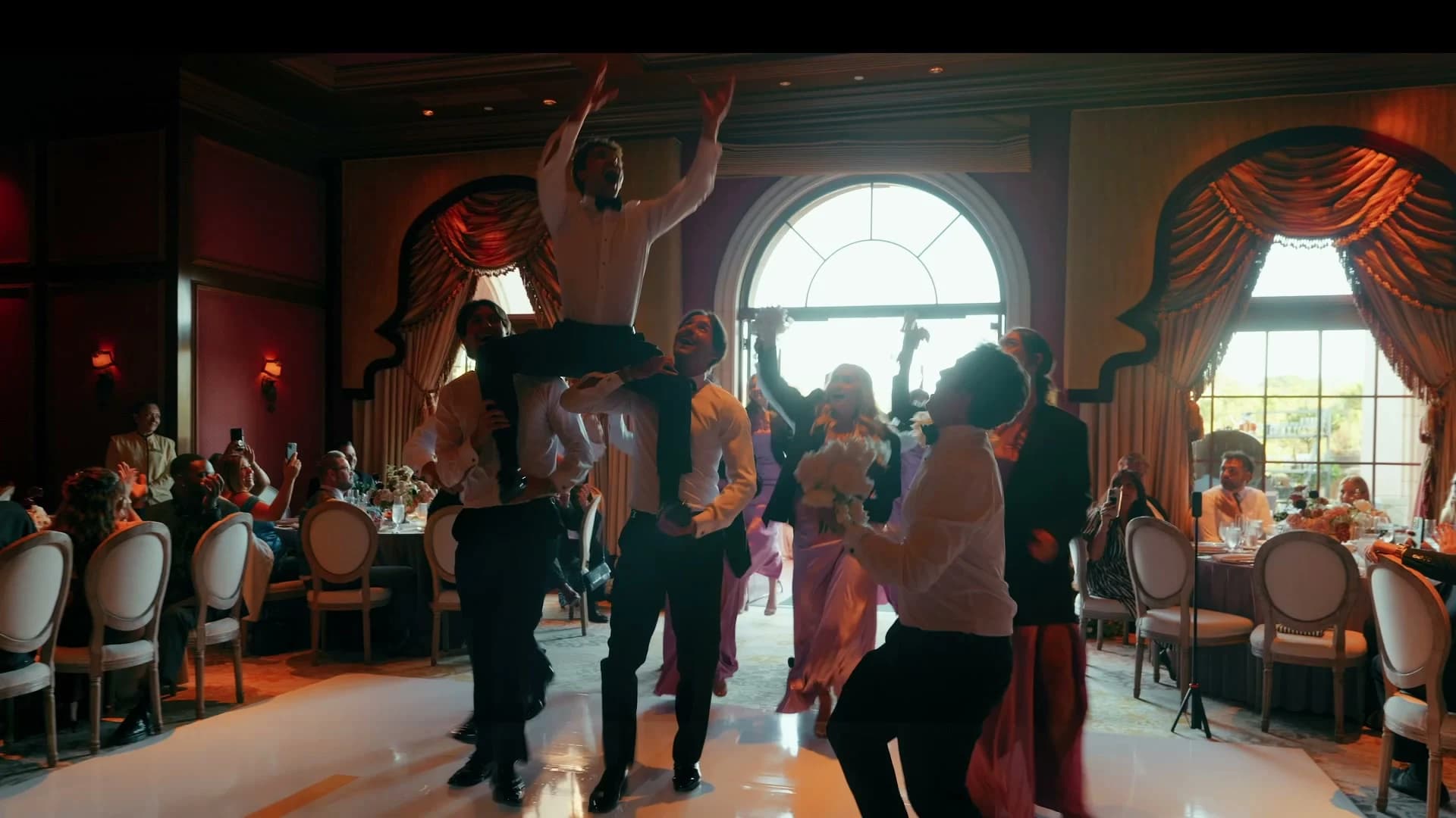 Guests dancing in the candlelit ballroom