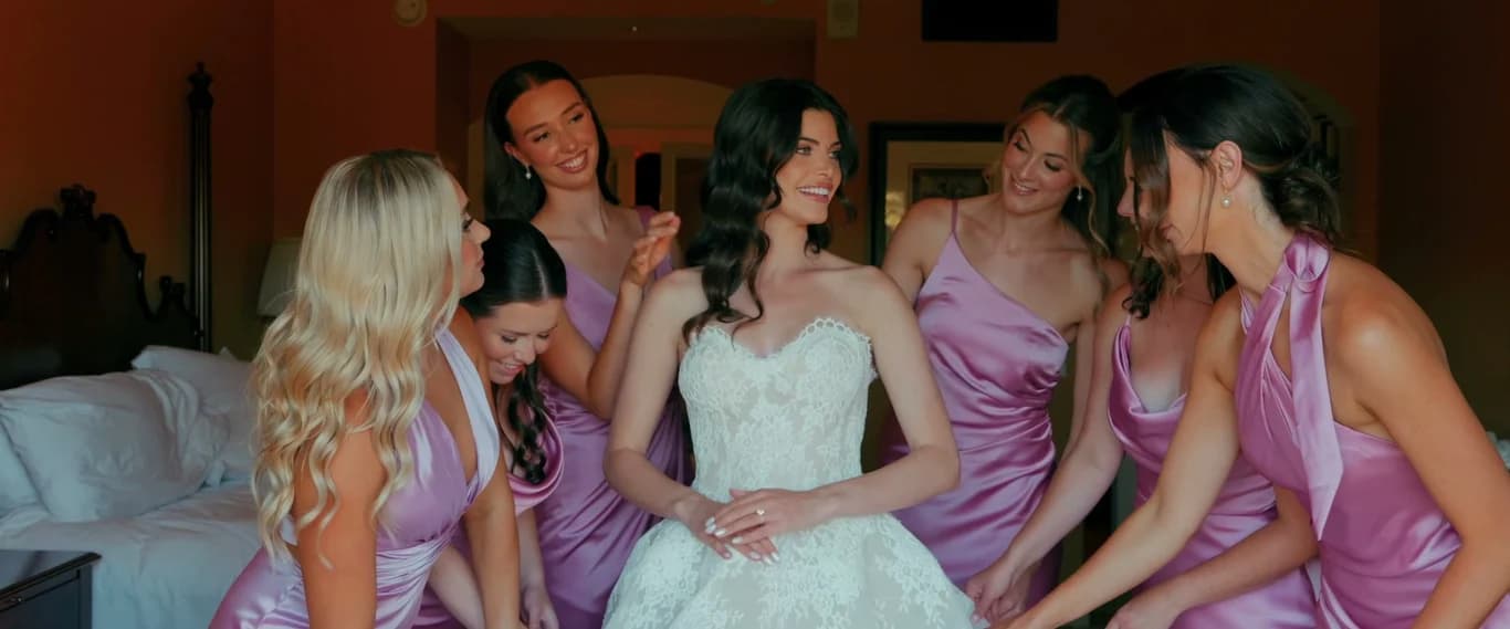 Kristen laughing with her bridesmaids before the ceremony