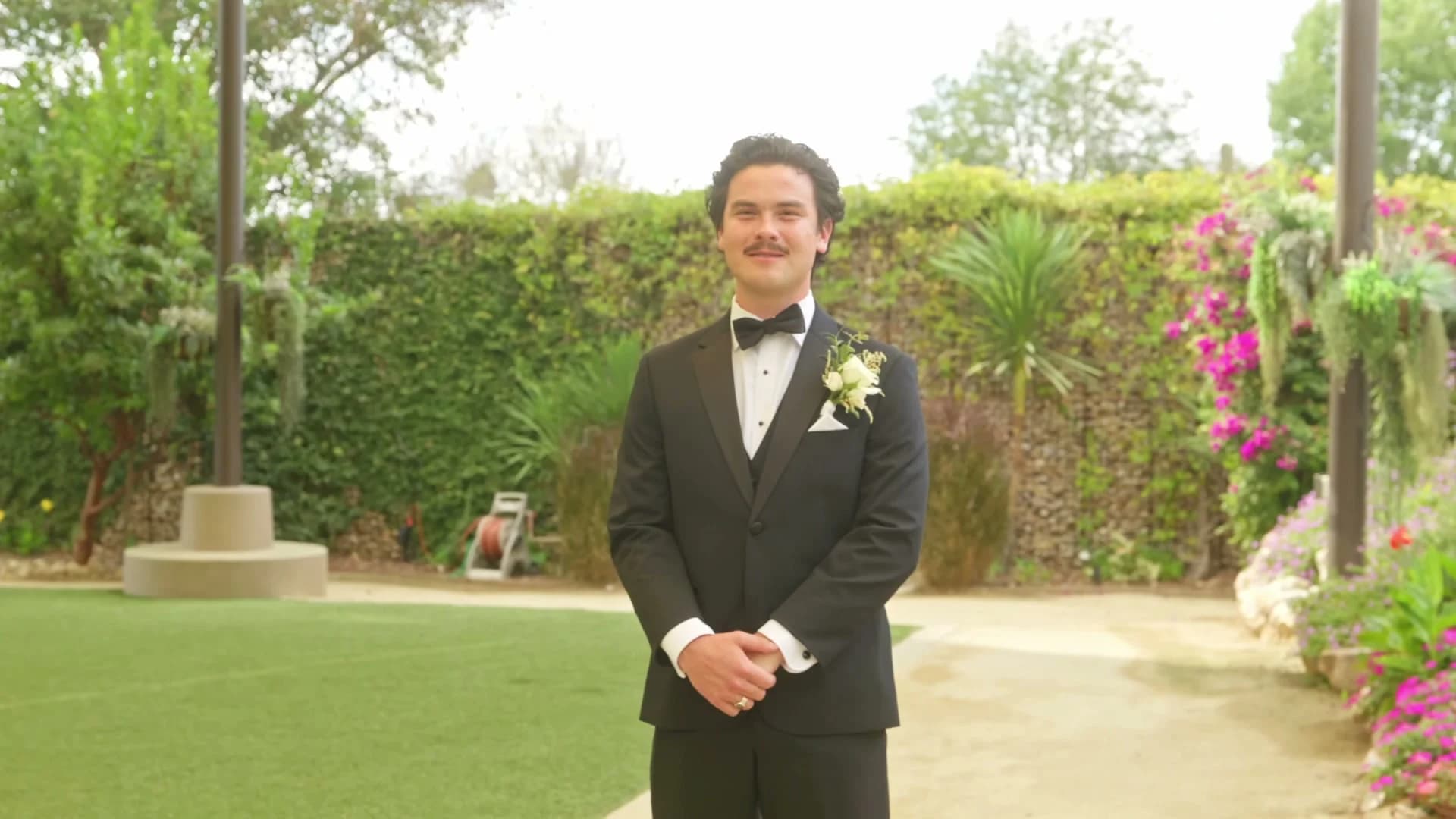 Zach waiting in the garden before the first look