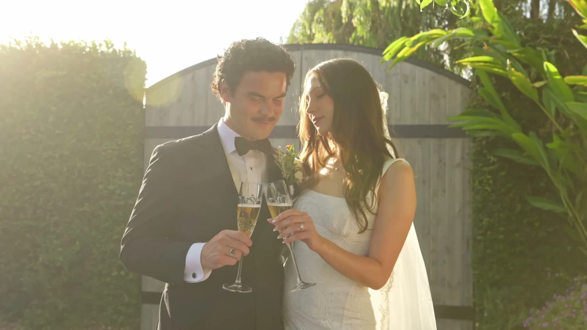 Zach + Madelin's champagne toast at golden hour